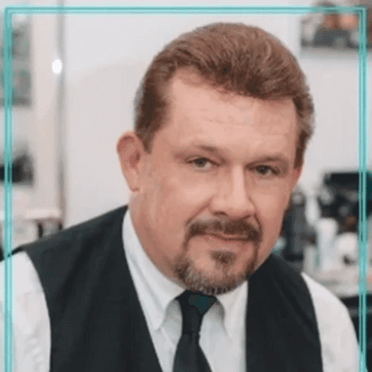 Portrait of Kirk Berry, a professional stylist at Hair After Style Quarters, showcasing their expertise and style.