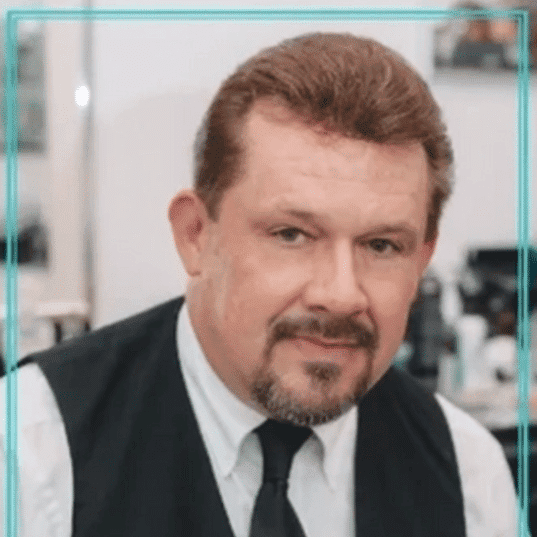 Portrait of Kirk Berry, a professional stylist at Hair After Style Quarters, showcasing their expertise and style.